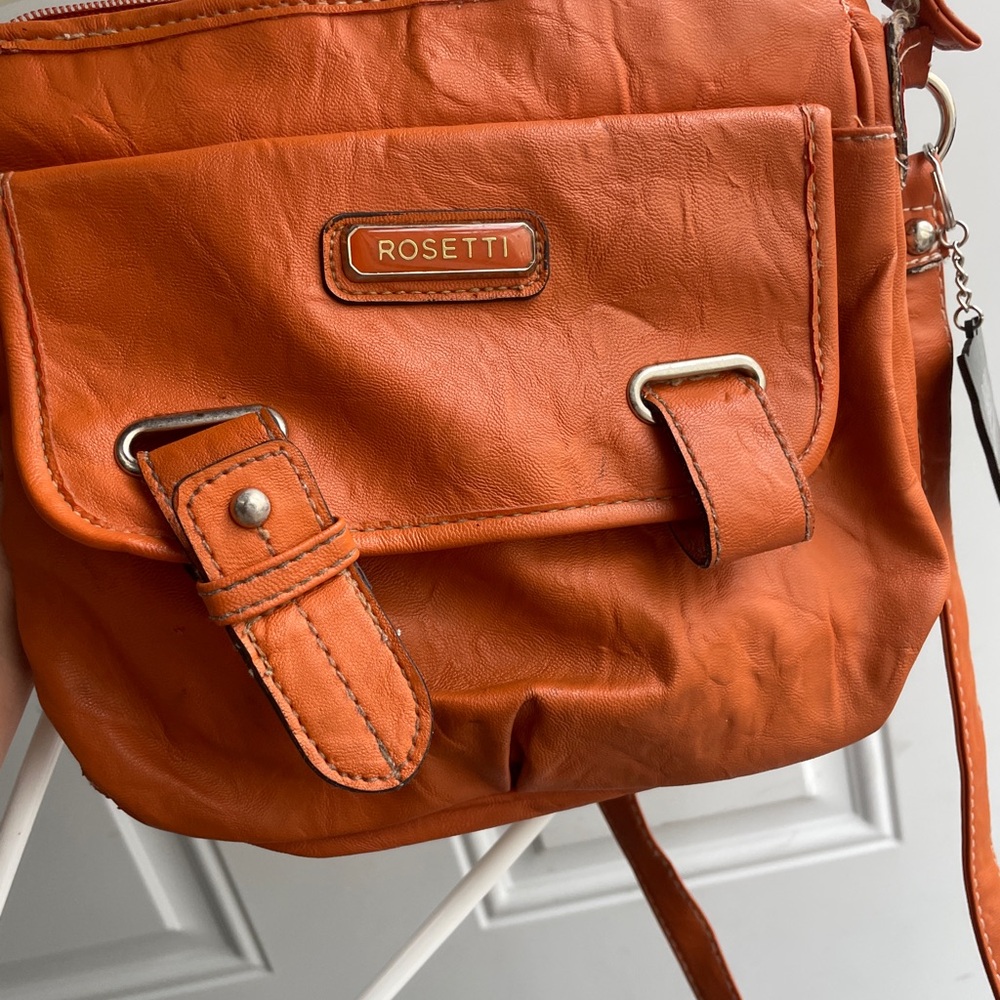 Rosetti Orange Faux-Leather Crossbody Bag with Buckle Accents